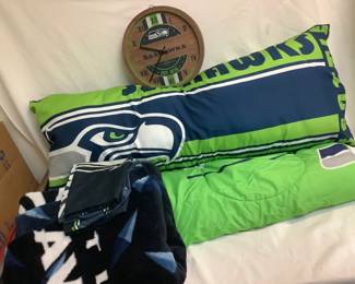 COCH806 Seahawks Blankets Seahawks bedspread and clock. Includes extra long pillow. Regular pillowcases, comforter and blanket.