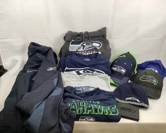 COCH327 Seattle Seahawks Clothing 1 Reebok Jacket size 2 XL, 2T-Shirts XL - one has a hole on the front - see pics, 1 Light Gray Long Sleeve Shirt 2XL, 0and 2XL, 1 Hooded Sweatshirt 2XL, 4 Baseball Caps, 1 Knit Cap and a Wallet.