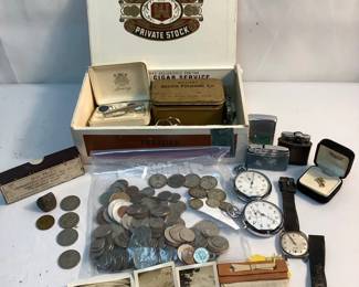 JUCR312 Mens Tie Clasp, Watches, Coins More Lot includes an assortment mostly of Canadian coins dating from 1964 - 1990's. There are 4 Rhodesia 10 cent coins from 1953-1964. There is one 1943 Canada Victory Nickel. Also included are lighters, watches, Tie Clasp and so much more.