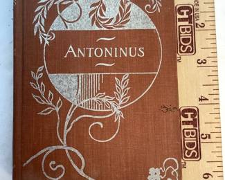 JUCR316 Antique Books And More Antonines isn't dated but likely mid-late 1800's. Published by Donahue, Henneberry & Co. There is some wear of the binding at the top of the book but overall book is in good condition. Evangeline by H. W. Longfellow was published by M.A. Donahue & Co. No date is listed but likely published in the mid 1800's.
