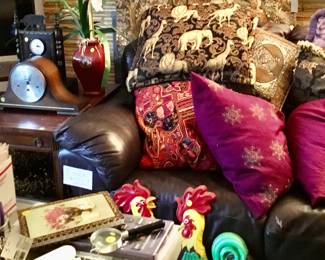 Leather couch, pillows.