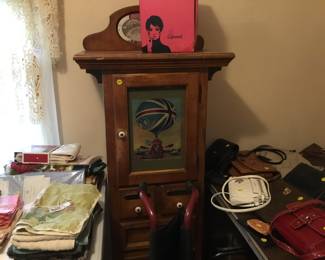 Vintage cabinet, wig box, wheelchair, walker, canes.
