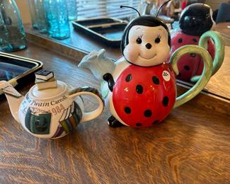 A74 - Left to Right $5 teapot, $20 Ladybug teapot (has small chip on foot)