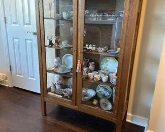 A9 - $275. Antique Cabinet with glass front and sides. Measures 40" wide x 15.75" deep x 58.75" tall. Excellent condition. 
