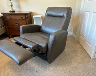 A26 - Faux Leather Rocker Recliner. Like new condition. Measures 31.5" wide x 30" deep x 38.5" tall. 