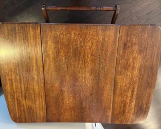 A19 - $125. Rolling Tea Cart with single drawer. Measures 33.25" long with handle x 20" wide with sides down (41" wide with sides out) x 28.75" tall. Great condition - sturdy. 