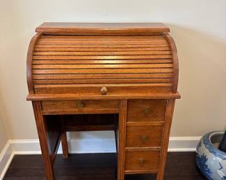 A7 - $125. Small Child Size Roll Top Desk. Top rolls smoothly - all drawers slide easily. Measures 23" wide x 15.25" deep x 33" tall. 