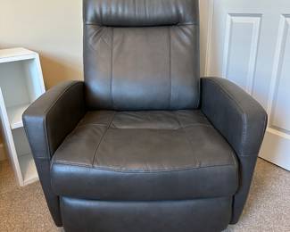 A26 - Faux Leather Rocker Recliner. Like new condition. Measures 31.5" wide x 30" deep x 38.5" tall. 