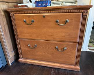 A117 - $25. 2 drawer wooden hanging filing cabinet. Measures 34.25 wide  x 19.75" deep x 30.5" tall. 