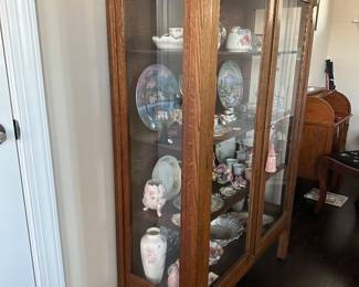 A9 - $275. Antique Cabinet with glass front and sides. Measures 40" wide x 15.75" deep x 58.75" tall. Excellent condition. 