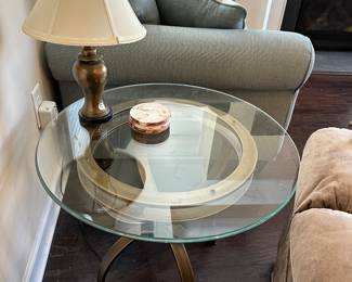 A12 - $45. Single round side table with glass top. Measures 26" round x 21.5" tall. 