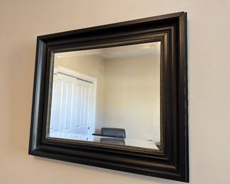 A33 - $20. Black Framed Mirror measures 26.25" x 22.5". 