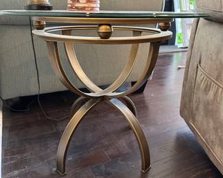 A12 - $45. Single round side table with glass top. Measures 26" round x 21.5" tall. 