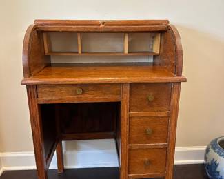 A7 - $125. Small Child Size Roll Top Desk. Top rolls smoothly - all drawers slide easily. Measures 23" wide x 15.25" deep x 33" tall. 