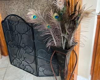 Fireplace screen and peacock feathers