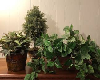 Faux plants of varying sizes and shapes.