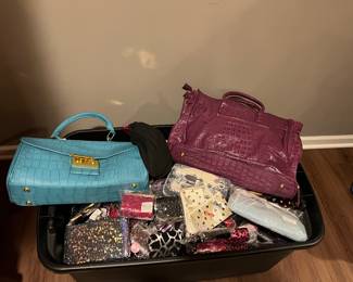 Multiple bins of new fashion purses from owner's boutique liquidation.