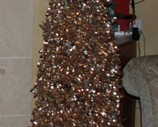 Decorative gold foil Christmas tree.  Was used as a store display.  Tons of bins of Christmas decorations and various themes.