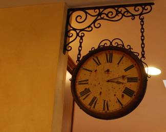 Large double sided hanging clock.
