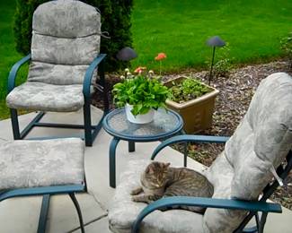 Part of the patio furniture set.  Two stationary chairs, ottoman and side table.  Powder coated green metal.