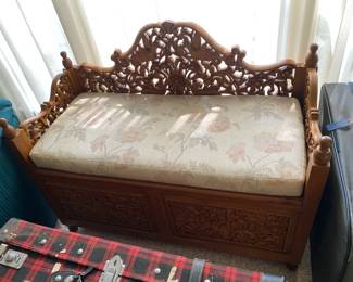 Heavily carved Indonesian storage bench