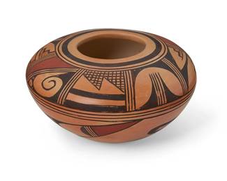 185
Verna Nahee (B. 1940, Hopi-Tewa)
A polychrome pottery low bowl, late 20th century
Signed to underside: Verna Nahee / Tewa Village / Polacca Ariz.
The yellowware nearly flat-shouldered bowl with three-color geometric and step motifs
3.75" H x 6.625" Dia.
Estimate: $200 - $400