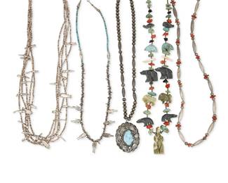 242
A Group Of Southwest-Style Necklaces
Mid/late 20th century
Each appears unmarked
Five works comprising a Zuni fetish-style necklace with multiple carved stone animals alternating with turquoise and coral stones (26" L x 2" H), two silver bead necklaces, one with coral beads (27" L) and one with a turquoise stone-set pendant (19" L x 2.25" H), as well as a multistrand Pueblo-style necklace with shell and silver animal fetish beads (27" L), and a necklace with silver metal nugget beads, figural accents and small turquoise beads (23" L), 5 pieces
245.3 grams gross
Estimate: $500 - $700