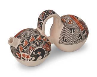 309
Yolanda Trujillo (B. 1963, Acoma Pueblo)
A double lobed polychrome pottery canteen, early 21st century
Marked to underside: Yolanda Trujillo / Acoma, N.M.
The two-compartment canteen featuring four-color geometric and kiva step motifs and featuring a black bear, a parrot, and a deer
6.25" H x 10.325" W x 4.625" D
Estimate: $100 - $200