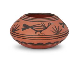 212
Robert Tenorio (B. 1950, Santo Domingo/Kewa Pueblo)
A pottery bowl, late 20th century
Incised to underside: Robert Tenorio / Santo Domingo Pueblo N.M.
The black on red bowl featuring avian and succulent motifs
4.125" H x 8" Dia.
Estimate: $400 - $600