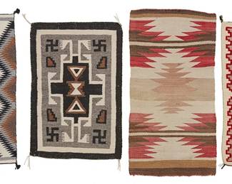 255
A Group Of Navajo Regional Rugs
Mid/late 20th century, Diné
Comprising four small weavings in various colors of wool including one with central stacked serrated diamonds in red wool (33.5" H x 20.5" W), one in black, grey, tan, and cream wool with a central stepped hooked diamond and floating motifs (31" H x 20.5" W), a longer textile with banding and overall sawtooth diamonds in red, cream, ochre, and brown wool (37.5" H x 19.25" W), and one in cream, tan, blue, green, black, and red wool with a central stepped banded motif and stepped border in red (32" H x 19.75" W), 4 pieces
Estimate: $300 - $500
