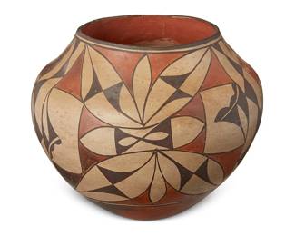 50
An Acoma Pueblo Pottery Olla Jar
Late 19th/early 20th century; New Mexico
Marked to underside: Acoma
The three-color polychrome jar painted in all-over foliate motifs
8.325" H x 10.325" Dia.
Estimate: $1,000 - $1,500