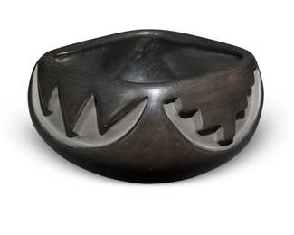 237
Madeline Naranjo (1916-2020, Santa Clara Pueblo)
A blackware pottery bowl, mid/late 20th century
Incised to underside: Madeline Naranjo / Santa Clara Pueblo
The bowl with squared rim and impressed kiva step and sawtooth motifs to waist
3" H x 5.25" Dia.
Estimate: $200 - $400