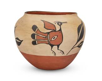 216
A Santo Domingo Pueblo Polychrome Pottery Jar
Mid-20th century; New Mexico
Unmarked
The three-color wide jar with black and red avian and leaf motifs on a white ground
10.5" H x 13" Dia.
Estimate: $600 - $800