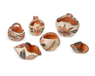 345
A Group Of Santa Domingo Pueblo Pottery Items
Early/mid-20th century; New Mexico
Each appears unmarked
The polychrome pottery group with various three-color floral and foliate motifs, comprising two with crimped rims, two with flared spouts, and two other handled baskets, 6 pieces
Largest: 5" H x 7.5" W x 5.75" D; smallest: 2.325" H x 4.875" W x 2.875" D
Estimate: $200 - $400