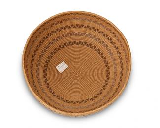 40
A Central California Basketry Bowl
Mid-20th century
A coiled polychrome bowl with five narrow snake motif bands and diagonal rim stitching
4.5" H x 9" Dia.
Estimate: $400 - $600