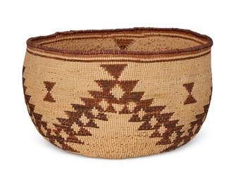 193
A Large Atsugewi Basket
Early 20th century; Pit River/Northeastern California
A twined utilitarian style basket with stepped sawtooth zigzag motifs
8.375" H x 13.5" Dia. approximately
Estimate: $1,200 - $1,800