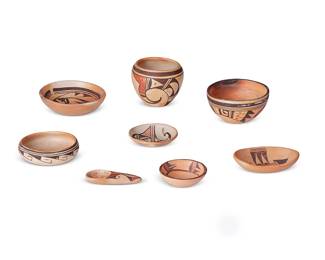 324
A Group Of Hopi Pueblo Polychrome Pottery Items
Mid/late 20th century; Arizona
Bird bowl signed: Annette Silas; small bowl signed: E. Adams / Hopi; spoon signed: C. Naha Nampeyo
The yellowware group comprising an Annette Silas (1915-1990, Hopi) bowl with three-color bird motif to interior, a Cheryl Naha Nampeyo (b. 20th century, Hopi) pottery spoon, and various bowls with geometric and avian motifs, 8 pieces
Tallest bowl: 4.125" H x 5.125" Dia.; spoon: 1" H x 4.5" L x 1.75" W
Estimate: $500 - $700