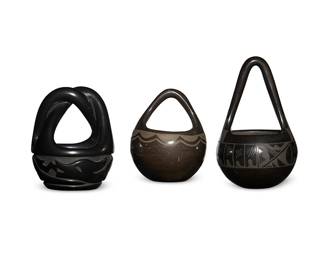 301
Three Puebloan Blackware Handled Pottery Bowls
Three works:

Mary Singer (b. 1936, Santa Clara Pueblo)
A blackware bowl, mid/late 20th century
Signed to underside: Mary Singer / Santa Clara Pueblo, New Mexico
The black on black handled bowl with twisted handle and carved Avanyu motif
5.625" H x 4.5" Dia.

Margaret Garcia (b. 20th century, Santa Clara Pueblo)
A small blackware handled bowl, 1988
Incised to underside: Margaret Garcia / Santa Clara Pue / N. Mex 88
The black on black bowl with tall pointed handle and banded geometric motifs
7.325" H x 4.5" Dia.

A small blackware handled bowl, mid-20th century
Appears unmarked
The black on black bowl with painted cloud motif edging
5.25" H x 4.25" Dia.

3 pieces
Estimate: $300 - $500