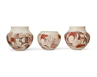 317
Loretta Navasie (B. 1948, Hopi-Tewa Pueblo)
Three Hopi Pueblo polychrome olla jars, late 20th century
Each signed to underside: [frog cipher] / L
The jars with red and black avian and geometric motifs on a white buff ground, 3 pieces
Largest: 5.875" H x 6.325" Dia.; 4.5" H x 5.75" Dia.
Estimate: $300 - $500
