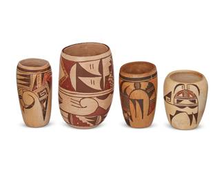 182
Four Hopi Pueblo Polychrome Pottery Vases
Mid/late 20th century; Arizona
One marked to underside: K. Collateta
Comprising three yellowware cylindrical vases with various figural motifs and one larger three-color cylindrical vase by Kathleen Collateta (b. 1969, Hopi/Jemez Pueblo) featuring all-over geometric motifs on white buff slip ground, 4 pieces
Largest: 7.625" H x 5.25" Dia.; smallest: 5.25" H x 4.25" Dia.
Estimate: $400 - $600