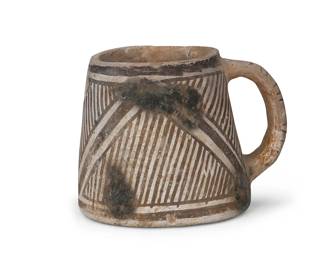 191
An Anasazi Pottery Mug
Pre-1500 AD
The black on white mug with lug handle and linear geometric motif
4" H x 5" Dia.
Estimate: $200 - $400