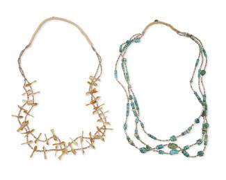 241
Two Pueblo Necklaces
Mid/late 20th century; Southwest United States
Comprising a double-strand Zuni-style necklace with multiple carved shell fetish birds and a triple-strand Santo Domingo-style necklace with nugget and bead turquoise, 2 pieces
Each: 30" L
Estimate: $300 - $500