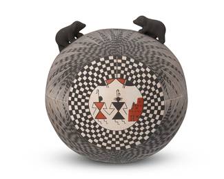 264
Selina Sanchez (B. 1957, Acoma Pueblo)
A fine line and polychrome pottery seed pot, late 20th/early 21st century
Marked to underside: Acoma, New Mexico / By: [Zia symbol] 'Selina Sanchez'
The three-color pot with fine line geometric motifs centering a domestic scene of a couple holding hands, surmounted by two applied black bear cubs
5.5" H x 5.5" Dia.
Estimate: $200 - $300