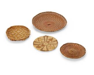 332
A Group Of Hopi Pueblo Baskets
Early/mid-20th century; Arizona
Four works comprising a polychrome coiled basketry tray (11" Dia.), two twined wicker basketry plaques (larger: polychrome, 17.5" Dia.; smaller: 10.375" Dia.), and a Hopi woven piki basket (2.75" H x 11.25" Dia.), 4 pieces
Estimate: $100 - $200