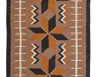 167
A Navajo Regional Rug
Mid-20th century, Diné
Woven in brown, black, ochre, and cream wool with three central Vallero star motifs and long hooked motifs to sides
53" H x 33" W
Estimate: $400 - $600