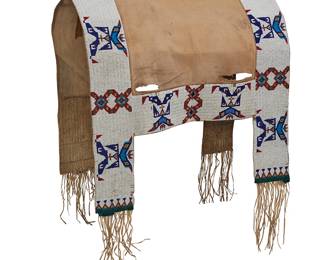 122
A Sioux Beaded Hide Saddle Blanket
Late 19th/early 20th century; Northern/Central Plains
With a cotton canvas body framed by heavily beaded mostly sinew-sewn hide side panels in alternating geometric motifs in white, red, blue, green, and metallic beads, with four tabs with green wool felt edging and hide fringing
57.25" H x 27.5" W; fringe: 8-9" L
Estimate: $3,000 - $5,000
