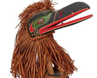 63
Stanley E. Hunt III (1958-2011, Kwakiutl/Kwakwaka'wakw)
A Kwakwaka'wakw/Kwakiutl raven clapper mask, 2003
Marked in ink to base: Stanley E. Hunt III / Kwakiutl Hamatsa Raven / Kingcome Inlet / British Columbia / Aug 2003
The polychrome painted wood, likely cedar Hamatsa raven mask with articulated clapper beak, cedar bark strips to top and skirting, with clapper pull beneath, and mounted to a painted wooden base
16.5" H x 19" W x 9" D including base
Estimate: $300 - $500