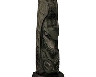 81
A Haida Argillite Totem Carving
Early 20th century; Pacific Northwest Coast
Unmarked
The carved stone totem representing two animal figures, likely an eagle perched above a wolf
10.5" H x 3.125" W x 3.125" D
Estimate: $800 - $1,200