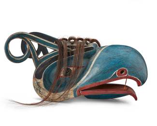 62
A Large Northwest Coast Raven Clapper Mask
Mid/late 20th century; Pacific Northwest Coast
Appears unmarked
A large polychrome painted carved wood raven mask in blue, red, and white, with an articulated beak with hide hinges, hide cord pull, and horse hair embellishments
13" H x 12.5" W x 26.5" D.
Estimate: $500 - $700
