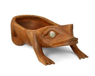 86
A Large Northwest Coast Frog Bowl
Early 20th century; Pacific Northwest Coast
A frog-form carved wood oval dish with legs, likely cedar, with inlaid abalone eyes and dentalia shell accents to bowl edge
6.5" H x 8.75" W x 23.5" D
Estimate: $500 - $700